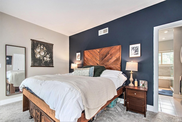 820 N Niles Ave Unit C, South Bend, IN 46617 - bedroom featuring light carpet, connected bathroom, and an accent wall