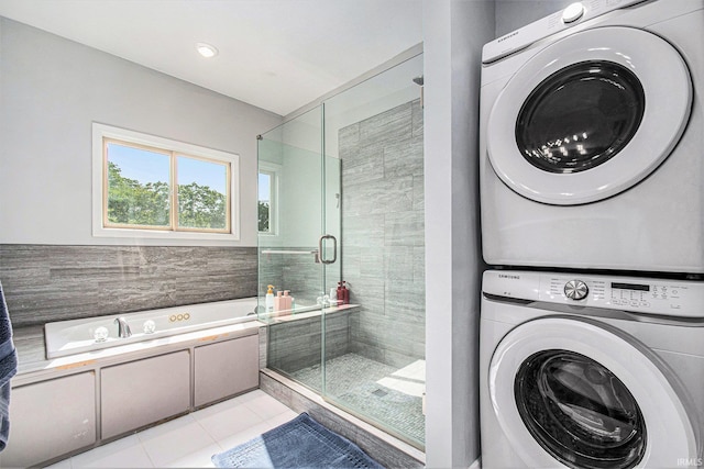 820 N Niles Ave Unit C, South Bend, IN 46617 - bathroom with stacked washer / drying machine, a stall shower, a garden tub, and tile patterned flooring