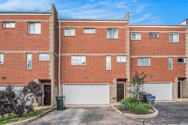 820 N Niles Ave Unit C, South Bend, IN 46617 - view of building exterior featuring driveway and a garage