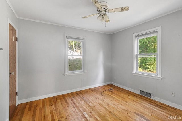 414 Klinger Ave, Plymouth, IN 46563 - unfurnished room featuring healthy amount of natural light, ornamental molding, hardwood / wood-style flooring, and a ceiling fan