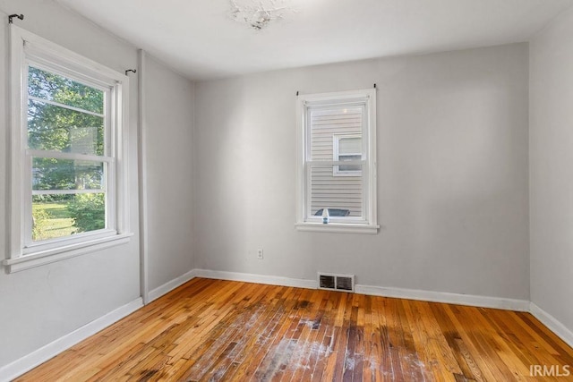 414 Klinger Ave, Plymouth, IN 46563 - empty room featuring hardwood / wood-style flooring and plenty of natural light