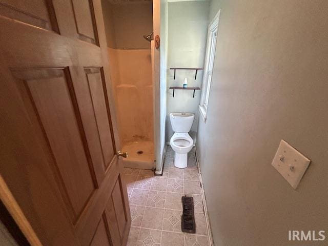 414 Klinger Ave, Plymouth, IN 46563 - bathroom with a stall shower and tile patterned flooring