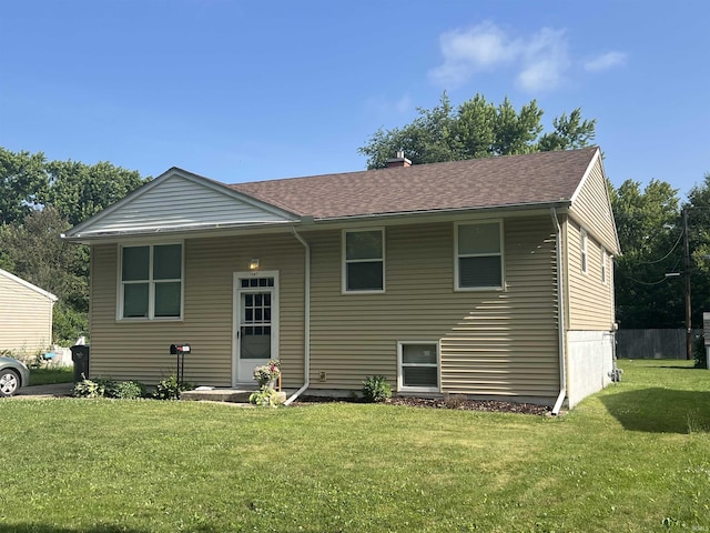 1507 W Ave, Goshen, IN 46526 - rear view of house featuring a lawn and roof with shingles