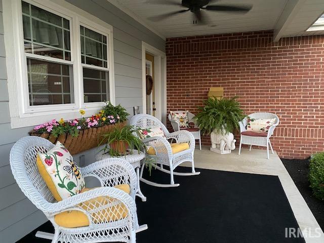 601 Railroad St, Covington, IN 47932 - covered porch featuring ceiling fan