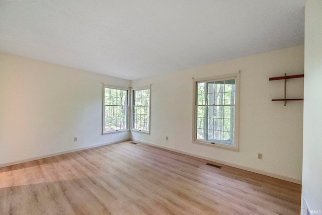 645 Pawnee Park, West Lafayette, IN 47906 - spare room featuring wood finished floors and plenty of natural light