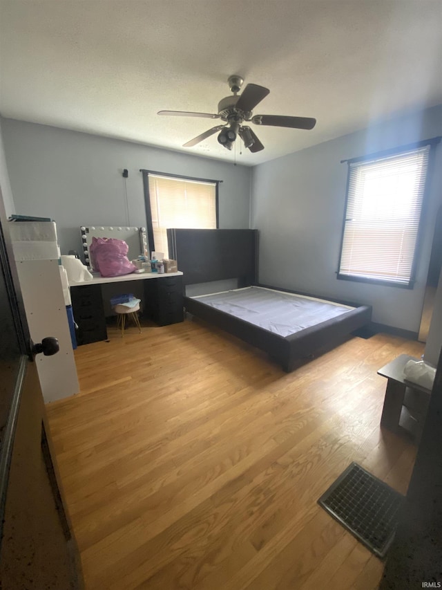 706 11th St, Tell City, IN 47586 - bedroom featuring light wood-style floors and ceiling fan