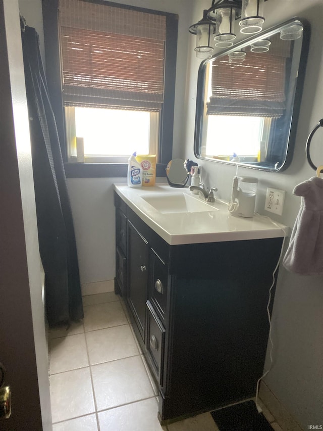 706 11th St, Tell City, IN 47586 - bathroom featuring tile patterned floors, vanity, and a chandelier