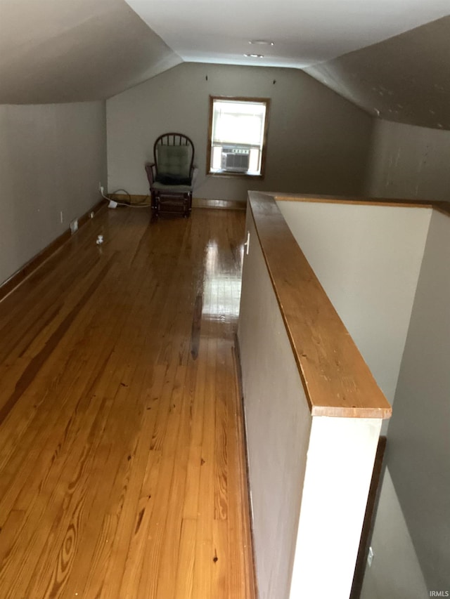 706 11th St, Tell City, IN 47586 - additional living space featuring vaulted ceiling, light wood-type flooring, and cooling unit