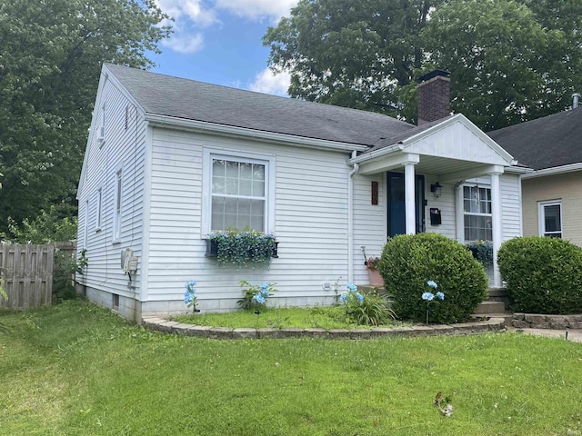 706 11th St, Tell City, IN 47586 - view of front facade featuring a chimney and a shingled roof