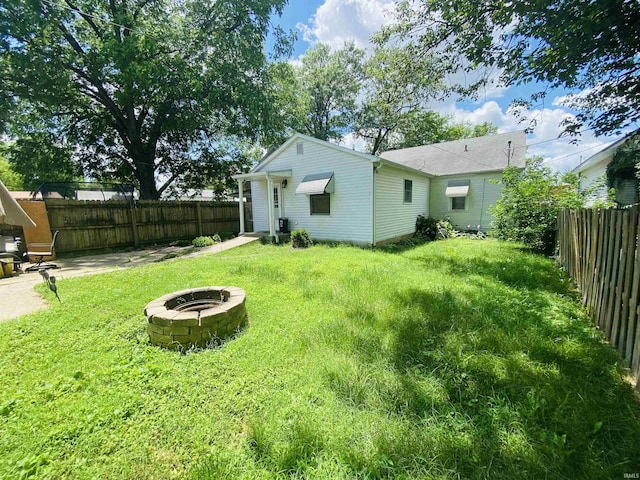706 11th St, Tell City, IN 47586 - fenced backyard featuring an outdoor fire pit