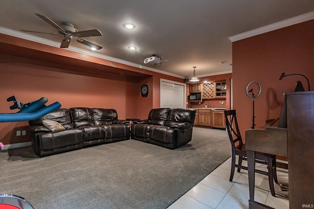 2200 E Boonville New Harmony Rd, Evansville, IN 47725 - home theater room with light colored carpet, crown molding, light tile patterned floors, bar with sink, and ceiling fan