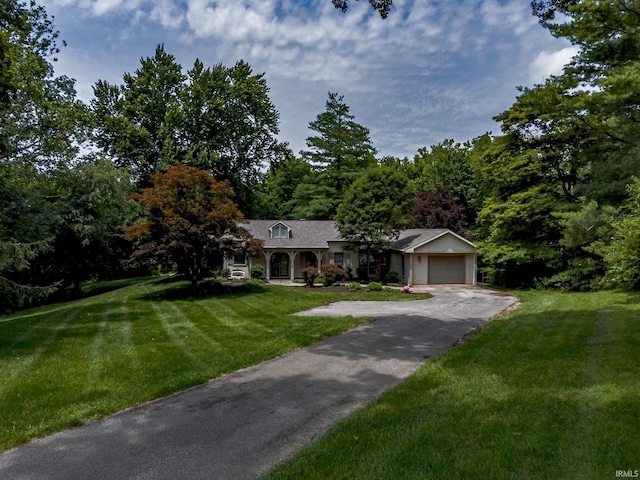 2200 E Boonville New Harmony Rd, Evansville, IN 47725 - ranch-style house featuring driveway, a front lawn, and an attached garage