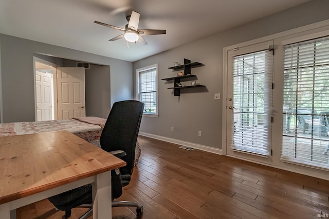 2200 E Boonville New Harmony Rd, Evansville, IN 47725 - office area with a ceiling fan and dark wood-style floors