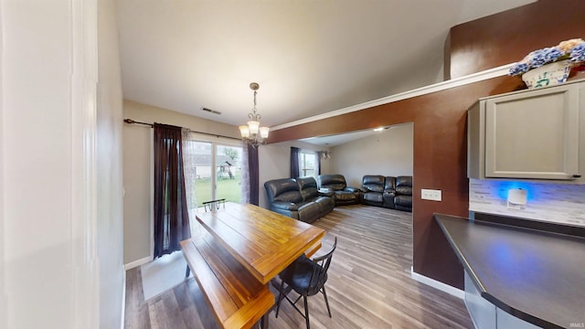 921 W Wheatfield Ln, Churubusco, IN 46723 - dining space featuring a chandelier and light wood-style floors