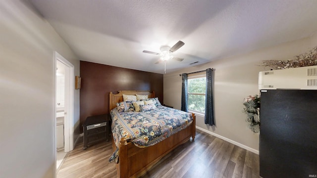921 W Wheatfield Ln, Churubusco, IN 46723 - bedroom featuring light wood-style floors, ceiling fan, and connected bathroom