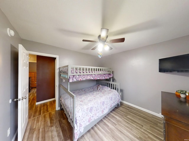 921 W Wheatfield Ln, Churubusco, IN 46723 - bedroom with wood finished floors and ceiling fan