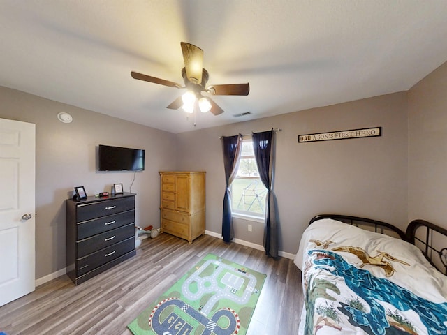 921 W Wheatfield Ln, Churubusco, IN 46723 - bedroom featuring light wood-type flooring and a ceiling fan