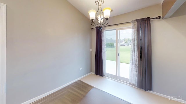 921 W Wheatfield Ln, Churubusco, IN 46723 - unfurnished dining area with a chandelier and vaulted ceiling