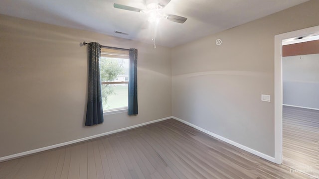 921 W Wheatfield Ln, Churubusco, IN 46723 - unfurnished room with ceiling fan and wood finished floors