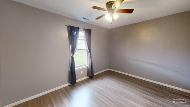921 W Wheatfield Ln, Churubusco, IN 46723 - empty room featuring wood finished floors and a ceiling fan