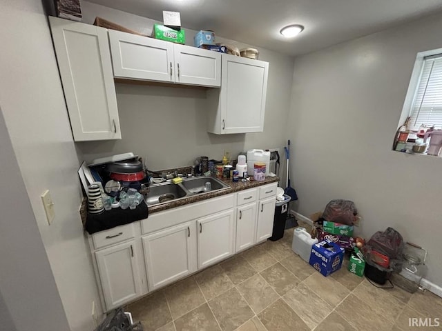 721 N 7th St, Vincennes, IN 47591 - kitchen with white cabinets and dark countertops