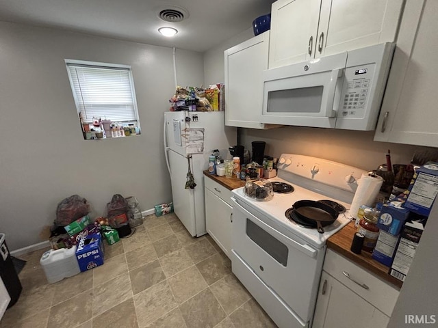 721 N 7th St, Vincennes, IN 47591 - kitchen featuring white appliances, white cabinets, and wooden counters