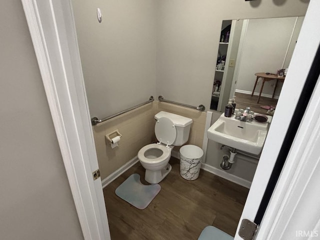 721 N 7th St, Vincennes, IN 47591 - bathroom featuring toilet and wood finished floors