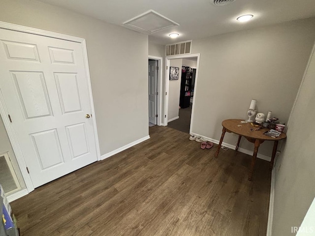 721 N 7th St, Vincennes, IN 47591 - corridor featuring dark wood-style floors and baseboards