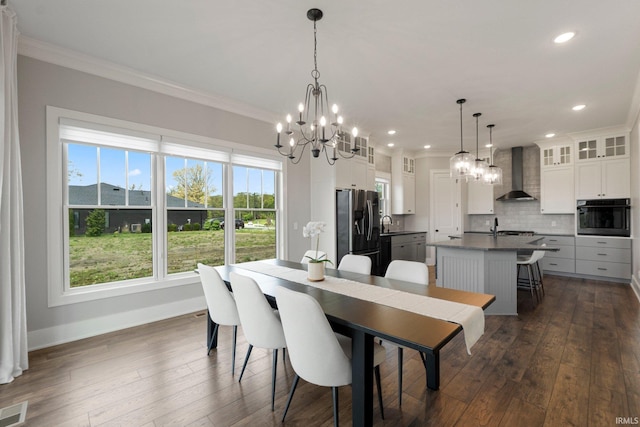 18015 Tullymore Ln, Leo, IN 46765 - dining area with a chandelier, crown molding, dark wood-style floors, and recessed lighting