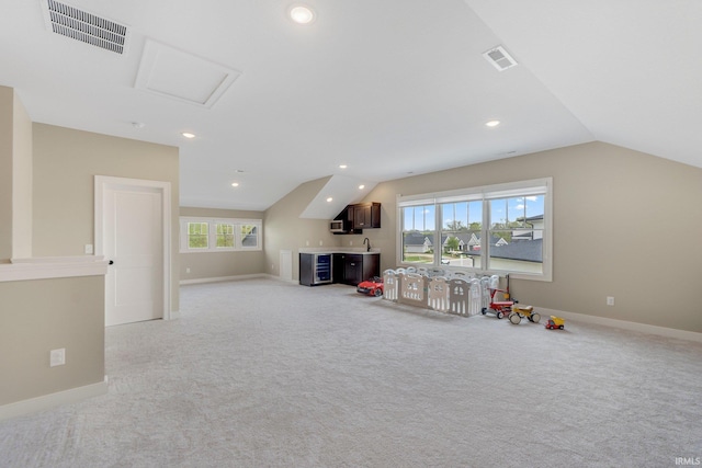 18015 Tullymore Ln, Leo, IN 46765 - rec room featuring lofted ceiling, beverage cooler, bar, light carpet, and recessed lighting
