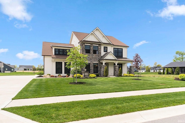 18015 Tullymore Ln, Leo, IN 46765 - craftsman-style house featuring a front yard and stone siding