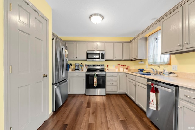 12426 Sonoma, Fort Wayne, IN 46818 - kitchen featuring stainless steel appliances, dark wood-type flooring, and light countertops