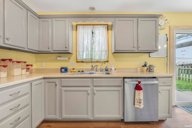 12426 Sonoma, Fort Wayne, IN 46818 - kitchen featuring stainless steel dishwasher, gray cabinets, wood finished floors, and light countertops