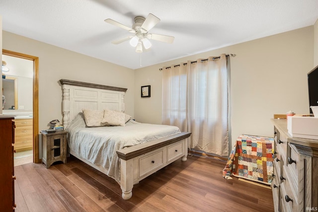 12426 Sonoma, Fort Wayne, IN 46818 - bedroom featuring dark wood-style floors, a ceiling fan, and connected bathroom
