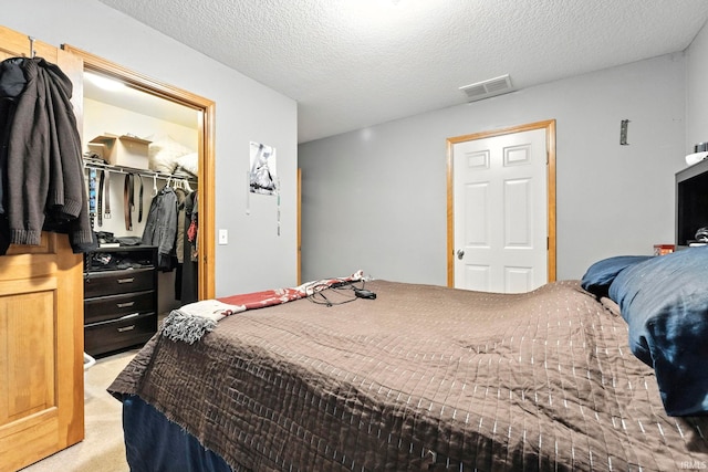 12426 Sonoma, Fort Wayne, IN 46818 - carpeted bedroom with a spacious closet, a closet, and a textured ceiling