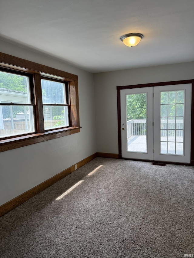 310 W Leith St, Fort Wayne, IN 46807 - empty room featuring healthy amount of natural light and carpet