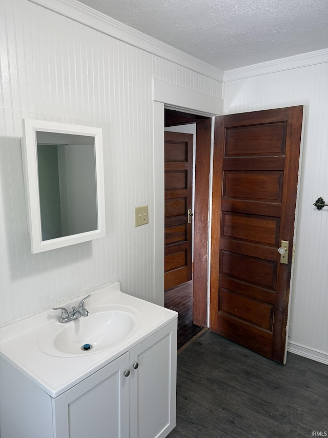 310 W Leith St, Fort Wayne, IN 46807 - bathroom featuring vanity, ornamental molding, and wood finished floors