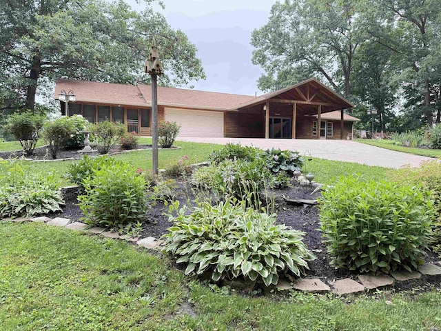 299 Spring Haven Rd, Mitchell, IN 47446 - single story home featuring concrete driveway, a garage, and a front yard