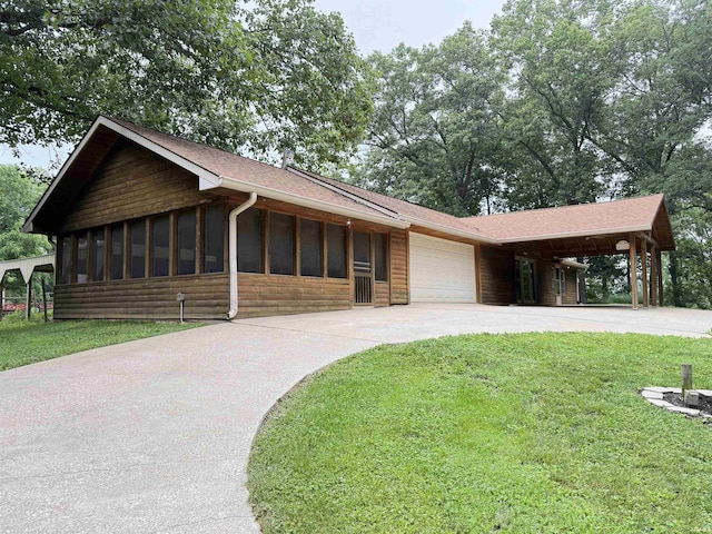 299 Spring Haven Rd, Mitchell, IN 47446 - view of front of home featuring a garage, a front yard, concrete driveway, roof with shingles, and log veneer siding