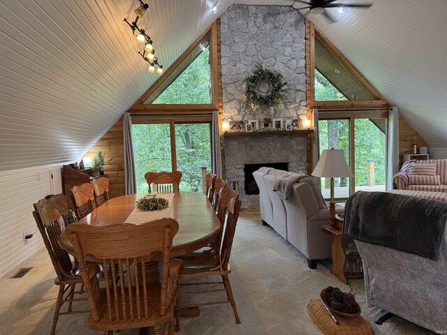 299 Spring Haven Rd, Mitchell, IN 47446 - carpeted dining space with a fireplace, high vaulted ceiling, and ceiling fan