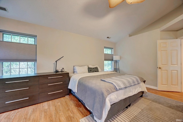 1045 E Chris Ln, Bloomington, IN 47401 - bedroom with light wood-type flooring and vaulted ceiling