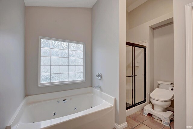 1045 E Chris Ln, Bloomington, IN 47401 - bathroom featuring a shower stall, a tub with jets, and tile patterned flooring