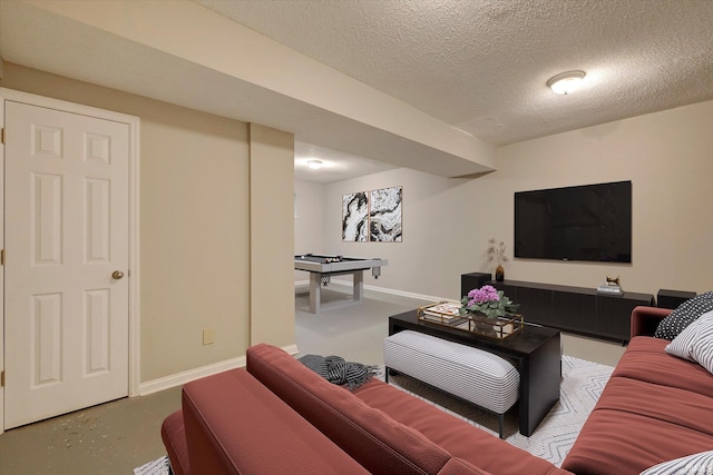1045 E Chris Ln, Bloomington, IN 47401 - living area featuring a textured ceiling and concrete flooring