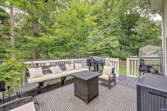 1045 E Chris Ln, Bloomington, IN 47401 - view of patio with an outdoor hangout area, a wooden deck, a grill, and a storage shed