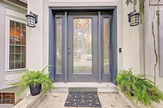 1045 E Chris Ln, Bloomington, IN 47401 - view of exterior entry with stucco siding