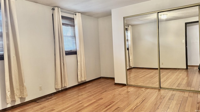 54213 Terrace Ln, South Bend, IN 46635 - unfurnished bedroom with light wood finished floors and a closet