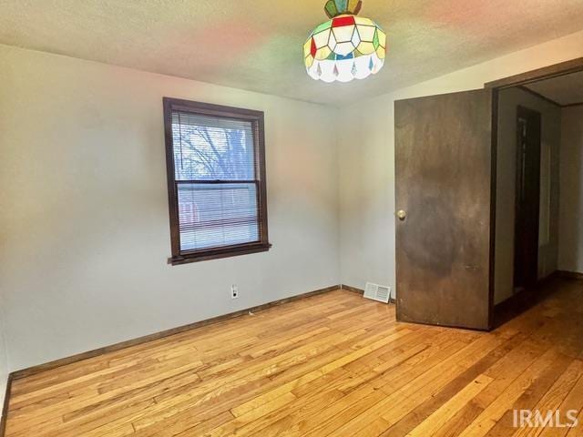 54213 Terrace Ln, South Bend, IN 46635 - spare room featuring light wood-style flooring and baseboards