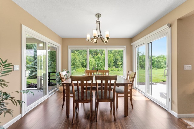 10057 Chapmans Cv, Fort Wayne, IN 46835 - dining area featuring dark wood-type flooring and a chandelier