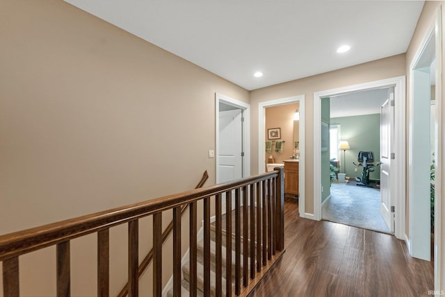 10057 Chapmans Cv, Fort Wayne, IN 46835 - hallway with an upstairs landing, dark wood finished floors, and recessed lighting
