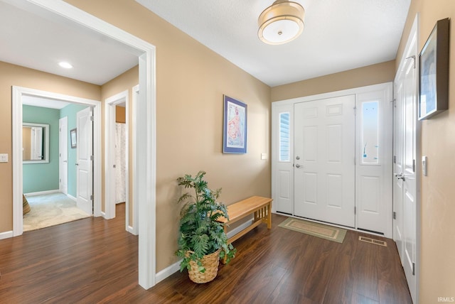 10057 Chapmans Cv, Fort Wayne, IN 46835 - foyer entrance with dark wood-type flooring and baseboards